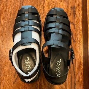 Wild pair, brand, sandals, black with industrial looking bottoms ,new!!